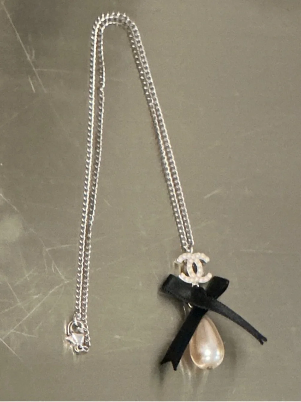 CHANEL Silver-Tone Necklace with Black Ribbon and Pearl Drop